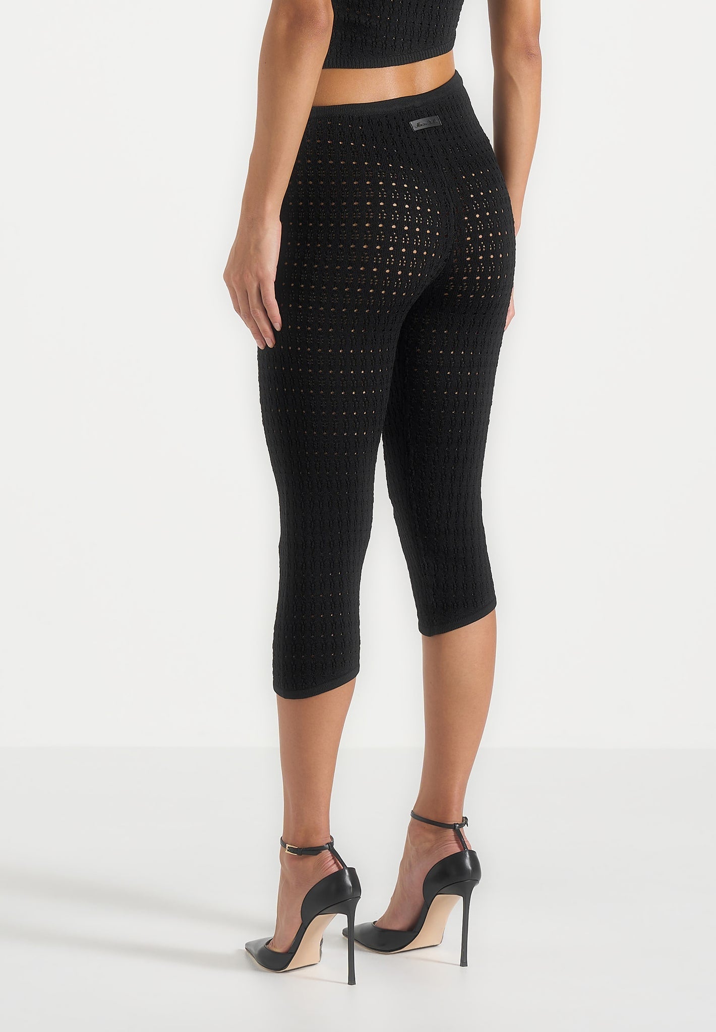 aimee-pointelle-asymmetric-capri-leggings-black