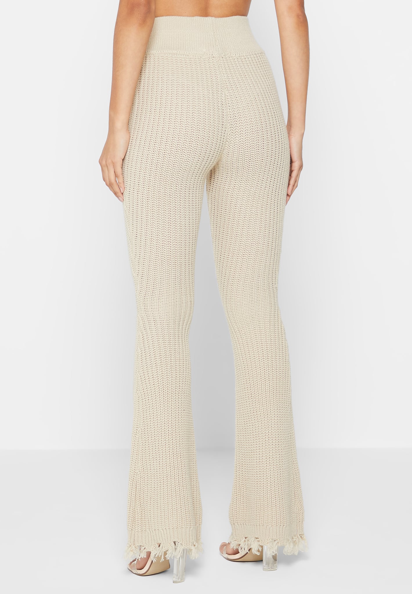 https://ca.manieredevoir.com/cdn/shop/files/distressed-knitted-fit-and-flare-trousers-beige3.jpg?v=1700221541